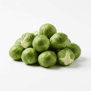 Fresh Brussels sprouts, whole and halved, on white background