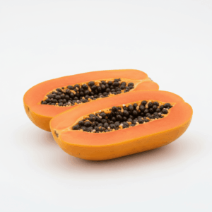 Fresh papaya, whole and sliced, on white background
